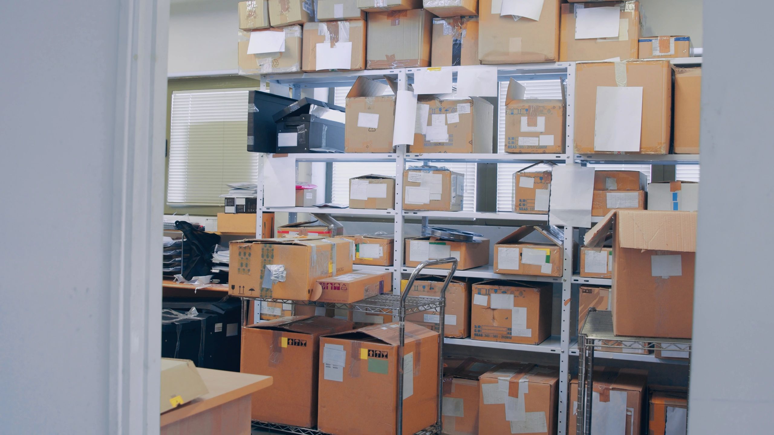 Warehouse trolley and boxes representing Zebra printer deployment for operations